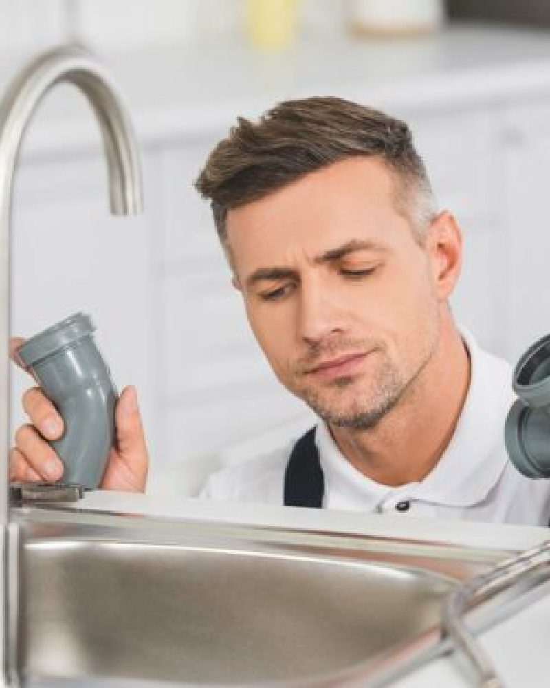 thoughtful-adult-repairman-holding-pipes-and-tools-resize-qwtd2dpiclhy1lqe8srm60pnfx2pn73teng64g1vhc